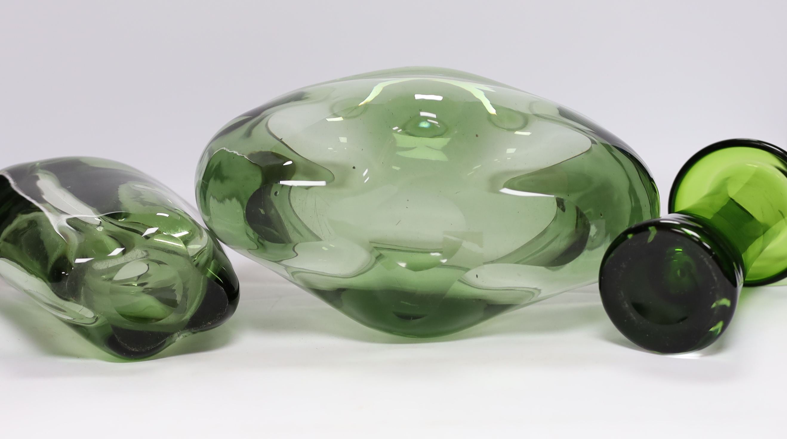 Two Whitefriars green glass vases, designed by James Hogan, and one other, largest 27cm wide